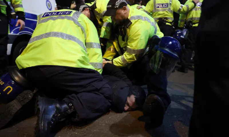 Police officers detain a protester outside the stadium during the match, Aston Villa v Maccabi Tel Aviv at Villa Park,  Birmingham, Britain on November 6, 2025. &mdash; Reuters