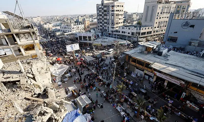 People gather and shop at a local market in Nuseirat, the central Gaza Strip on October 28. &mdash; Reuters/File