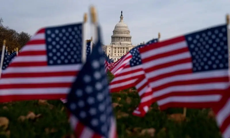 American flags flutter in front of the US Capitol more than a month into the continuing US government shutdown in Washington, DC, US, November 7. &mdash; Reuters
