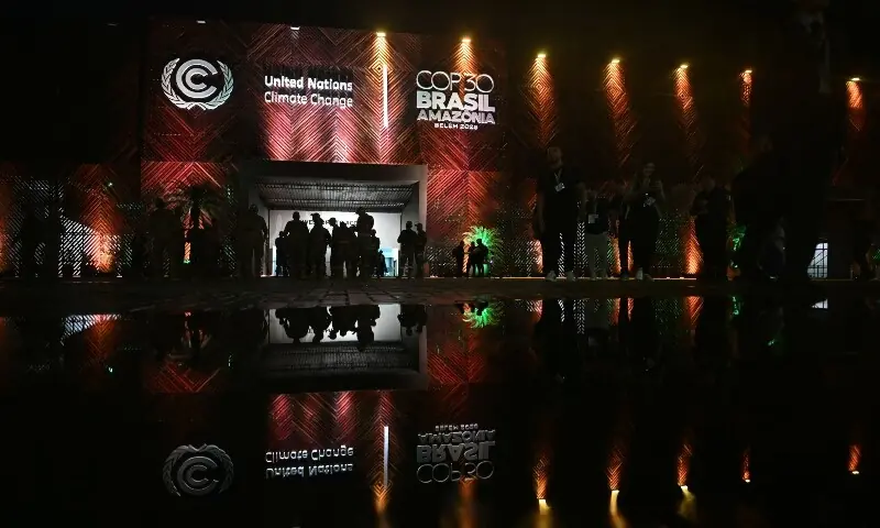 This view shows the main entrance of the COP30 UN Climate Change Conference building at night in Belem, Para State, Brazil on November 7. &mdash; AFP