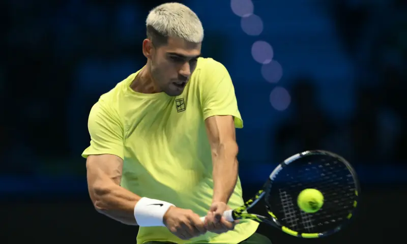 Spain&rsquo;s Carlos Alcaraz hits a return against Australia&rsquo;s Alex De Minaur at the ATP Finals tennis tournament in Turin on November 9, 2025. &mdash; AFP