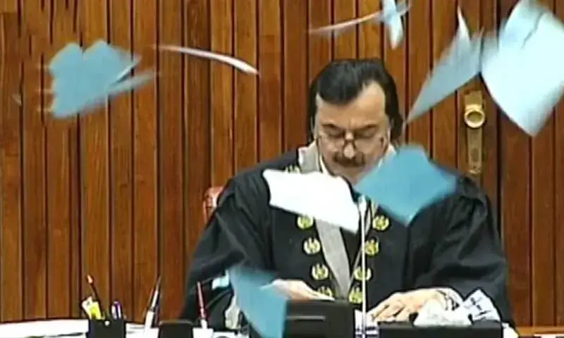 Senate Chairperson Syed Yousaf Raza Gilani reads the bill for a 27th Constitutional Amendment for clause-by-clause voting in the upper house of Parliament as the opposition rips copies of the bill in protest on Nov 10. &mdash; DawnNewsTV