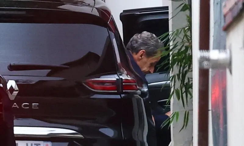 Former French President Nicolas Sarkozy arrives at his house after a Paris court granted him an early release from jail, pending an appeal, weeks after he started a five-year sentence for conspiring to raise campaign funds from Libya, in Paris, France, November 10. &mdash; Reuters