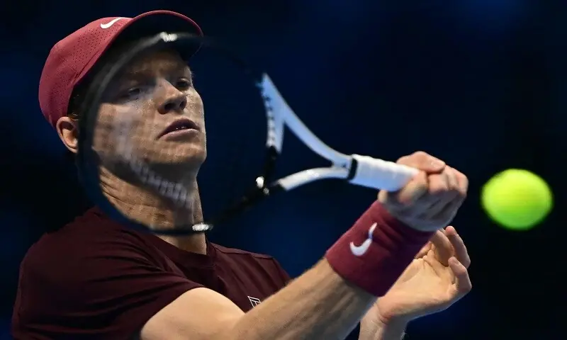 Italy&rsquo;s Jannik Sinner hits a return during his match against Canada&rsquo;s Felix Auger-Aliassime at the ATP Finals  in Turin on November 10, 2025.&mdash;AFP