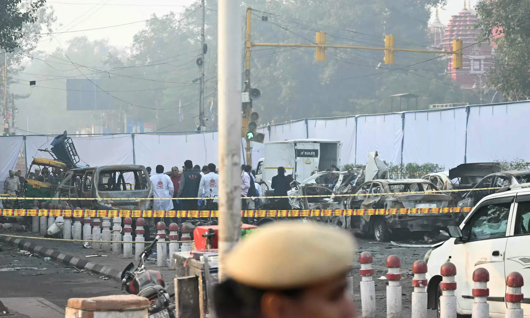 Forensic experts investigate at the blast site following an explosion near the Red Fort in the old quarters of Delhi on Nov 11, 2025. &mdash; AFP