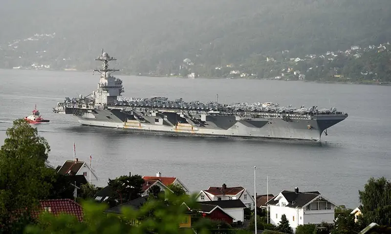 The USS Gerald Ford, the world&rsquo;s largest aircraft carrier, sails into the Oslofjord past Droebak and Oscarsborg fortress on its way for a port visit to Oslo, Norway on September 12. &mdash; Reuters/File