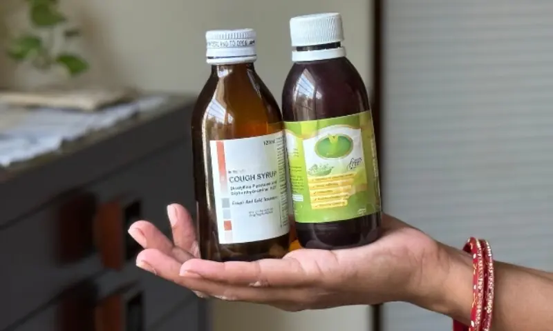 Rakhi Matan holds bottles of cough syrup in her palm. This is what she gave to her kids two weeks back when they were feeling ill. &mdash; Zofeen Ebrahim
