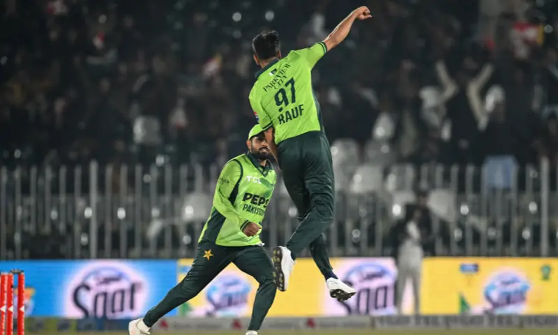 Pakistan’s Haris Rauf (R) celebrates with teammate Babar Azam after taking the wicket of Sri Lanka’s Kusal Mendis during the first one-day international (ODI) cricket match between Pakistan and Sri Lanka at the Rawalpindi Cricket Stadium in Rawalpindi on November 11, 2025. — AFP