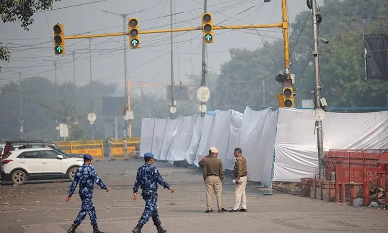 Security personnel patrol near the site of an explosion near the historic Red Fort in the old quarters of New Delhi, India on November 12. &mdash; Reuters