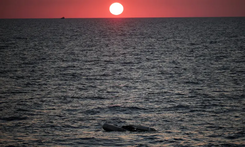 In this file photo, a rubber boat used by migrants floats at the sea on sunset, as seen from the migrant search and rescue ship Sea-Watch 5, operated by German NGO Sea-Watch, in the search and rescue (SAR) zone in the central Mediterranean, off Libya on August 9, 2025. &mdash; Reuters/File