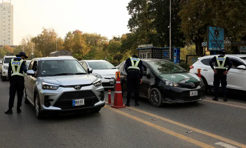 Police officers check the identification of drivers at a security check post along a road following Tuesday&rsquo;s blast outside the district court building, in Islamabad on November 12, 2025. &mdash; Reuters