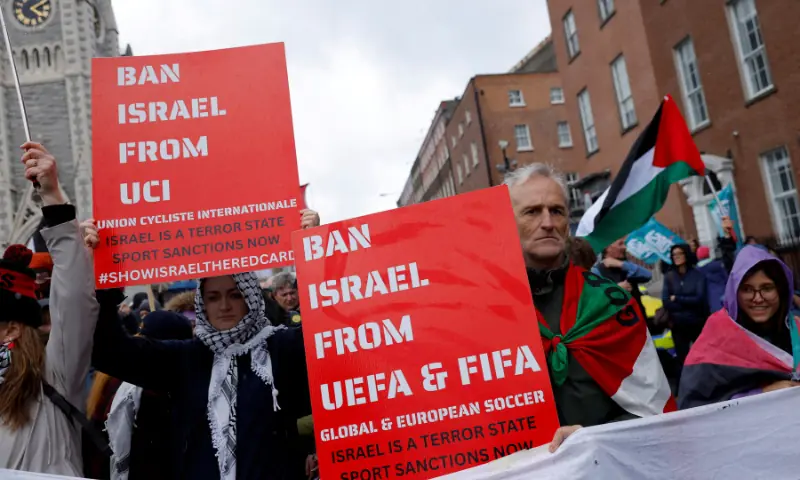 Demonstrators hold placards calling for Israel to be banned from the Union of Cycling International (UCI), UEFA and FIFA global and European soccer, in support of Palestinians during a national protest, ahead of the two year anniversary of the October 7, 2023 attack on Israel by Hamas from Gaza, in Dublin, Ireland, October 4 2025. — Reuters/File Demonstrators hold placards calling for Israel to be banned from the Union of Cycling International (UCI), UEFA and FIFA global and European soccer, in support of Palestinians during a national protest, ahead of the two year anniversary of the October 7, 2023 attack on Israel by Hamas from Gaza, in Dublin, Ireland, October 4 2025. — Reuters/File