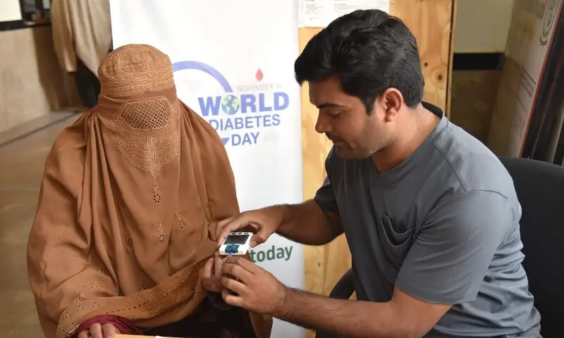 A health worker conducts a diabetes rapid test during a screening activity organised by World Health Organisation and the Ministry of Health on the occasion of World Diabetes Day. &mdash; WHO