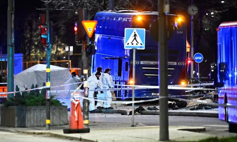 Police technicians work on the site where a bus hit into a bus shelter in Ostermalm in Stockholm, Sweden, November 14. &mdash; Reuters