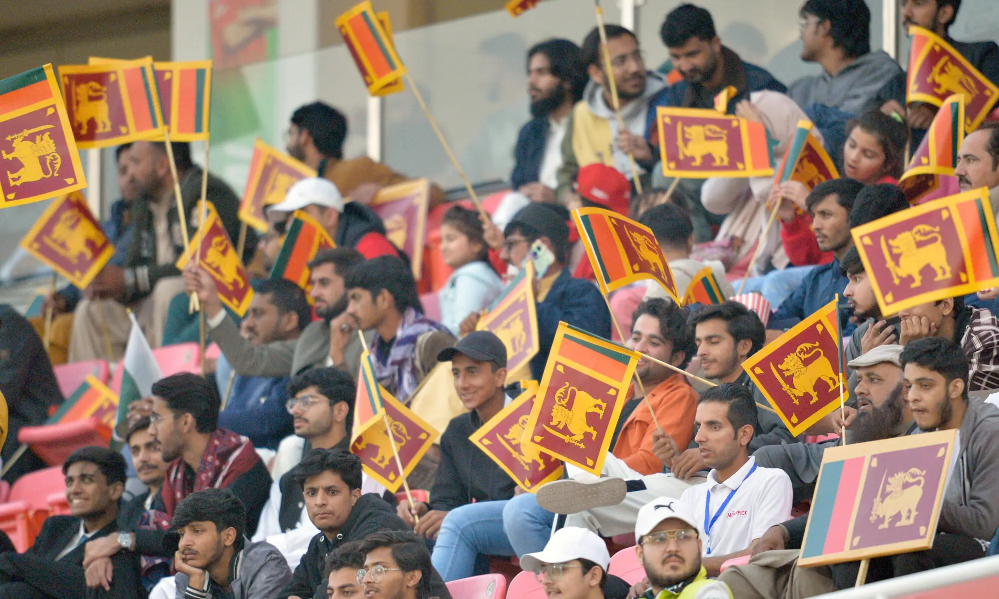 Fans hold Sri Lankan flags during the second One-day International between Sri Lanka and Pakistan at the Rawalpindi Cricket Stadium on November 14, 2025.&mdash;Tanveer Shahzad/White Star