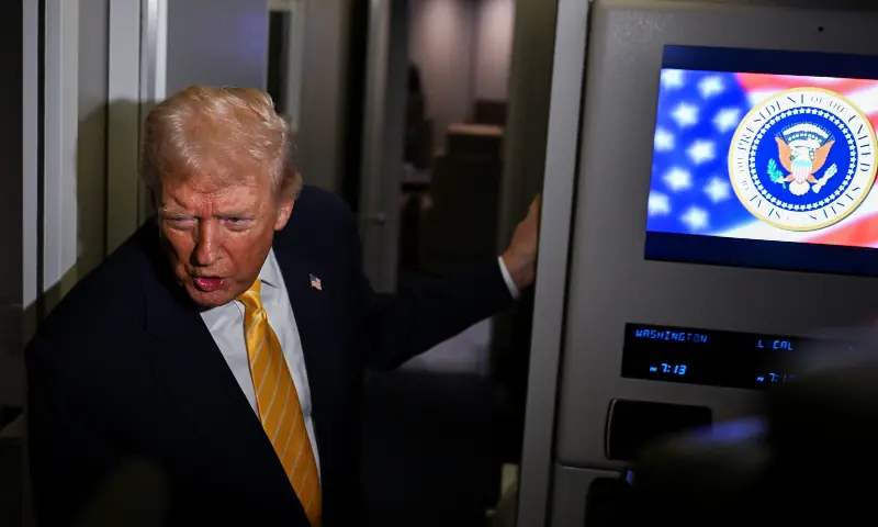 US President Donald Trump talks to members of the press on board Air Force One en route to Florida, US on Nov 14, 2025. &mdash; Reuters
