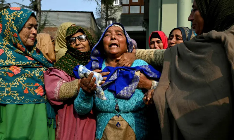Relatives of the victims who died in an accidental blast at Nowgam police station, mourn in their house on the outskirts of occupied Srinagar, on Nov 15, 2025. &mdash; AF[