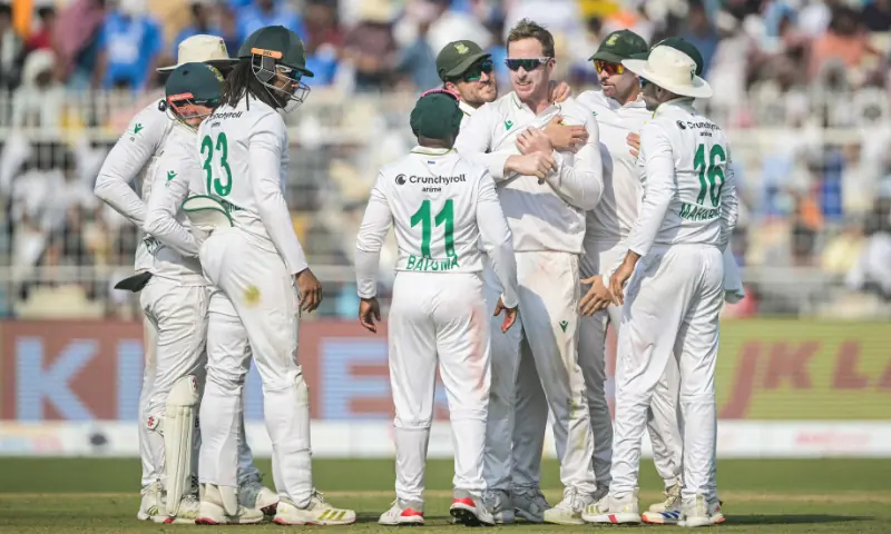 South Africa&rsquo;s Simon Harmer (3R) celebrates with teammates after taking the wicket of India&rsquo;s Kuldeep Yadav during the third day of the first Test cricket match between India and South Africa at the Eden Gardens in Kolkata on November 16, 2025. &mdash; AFP