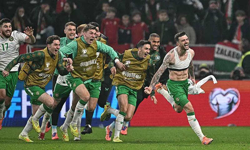 Ireland&rsquo;s Troy Parrott (R) celebrates scoring the winner during the FIFA World Cup 2026 Group &lsquo;F&rsquo; European qualification match between Hungary and Ireland at the Puskas Arena in Budapest, Hungary on November 16, 2025.&mdash;AFP