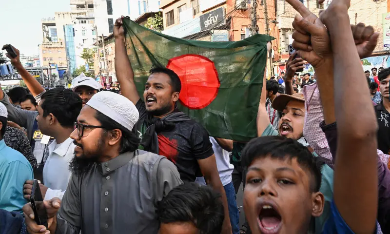 People wave Bangladesh’s national flag as they celebrate the court’s verdict after fugitive former Prime Minister Sheikh Hasina was found guilty and sentenced to death in Dhaka on November 17, 2025. — AFP People wave Bangladesh’s national flag as they celebrate the court’s verdict after fugitive former Prime Minister Sheikh Hasina was found guilty and sentenced to death in Dhaka on November 17, 2025. — AFP
