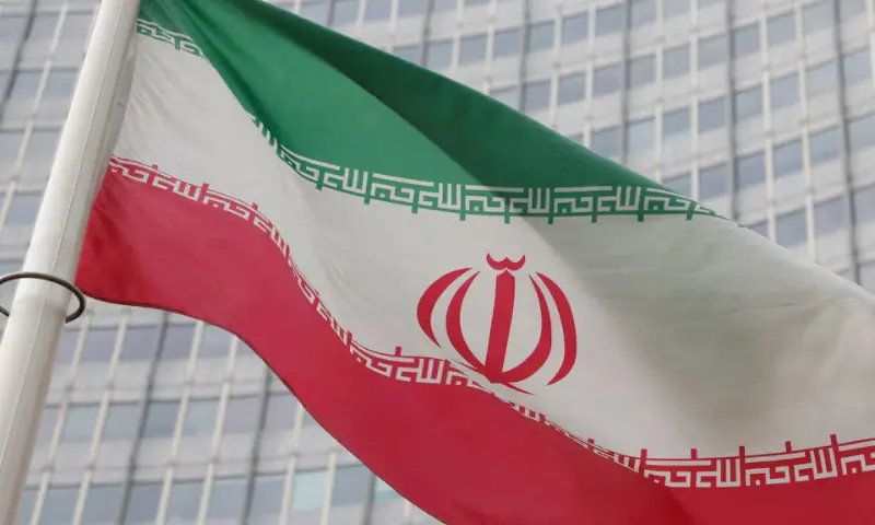 The Iranian flag flutters outside the International Atomic Energy Agency (IAEA) headquarters in Vienna, Austria, on March 6, 2023. &mdash; Reuters/File