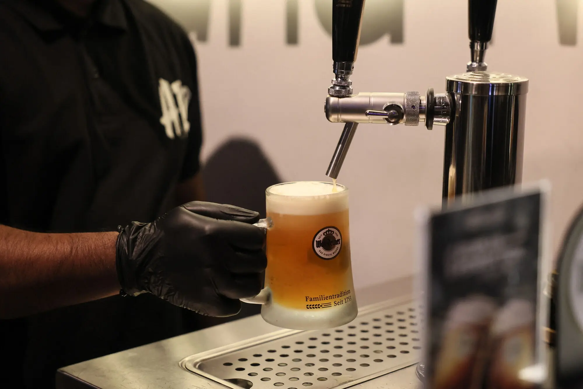 A bartender at Riyadh’s  A-12 cafe pours a pint of draft beer into a mug. Photo: AFP 