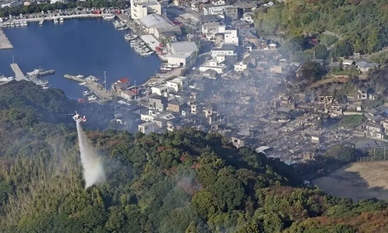 Smoke rises from the site where a massive fire blazed through more than 170 buildings, as seen from a helicopter, in Oita, Oita Prefecture, southwestern Japan, Nov 19. &mdash; Reuters