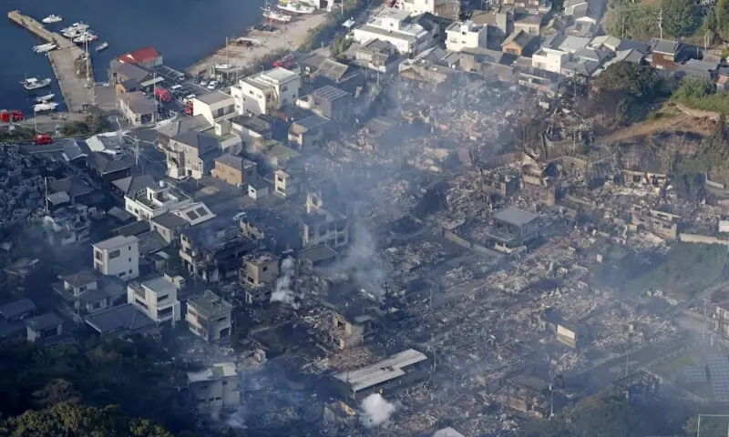 Smoke rises from the site where a massive fire blazed through more than 170 buildings, as seen from a helicopter, in Oita, Oita Prefecture, southwestern Japan, Nov 19. &mdash; Reuters