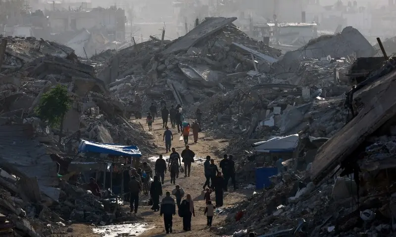Palestinians walk among piles of rubble, amid a ceasefire between Israel and Hamas, in the northern Gaza Strip November 19. — Reuters Palestinians walk among piles of rubble, amid a ceasefire between Israel and Hamas, in the northern Gaza Strip November 19. — Reuters