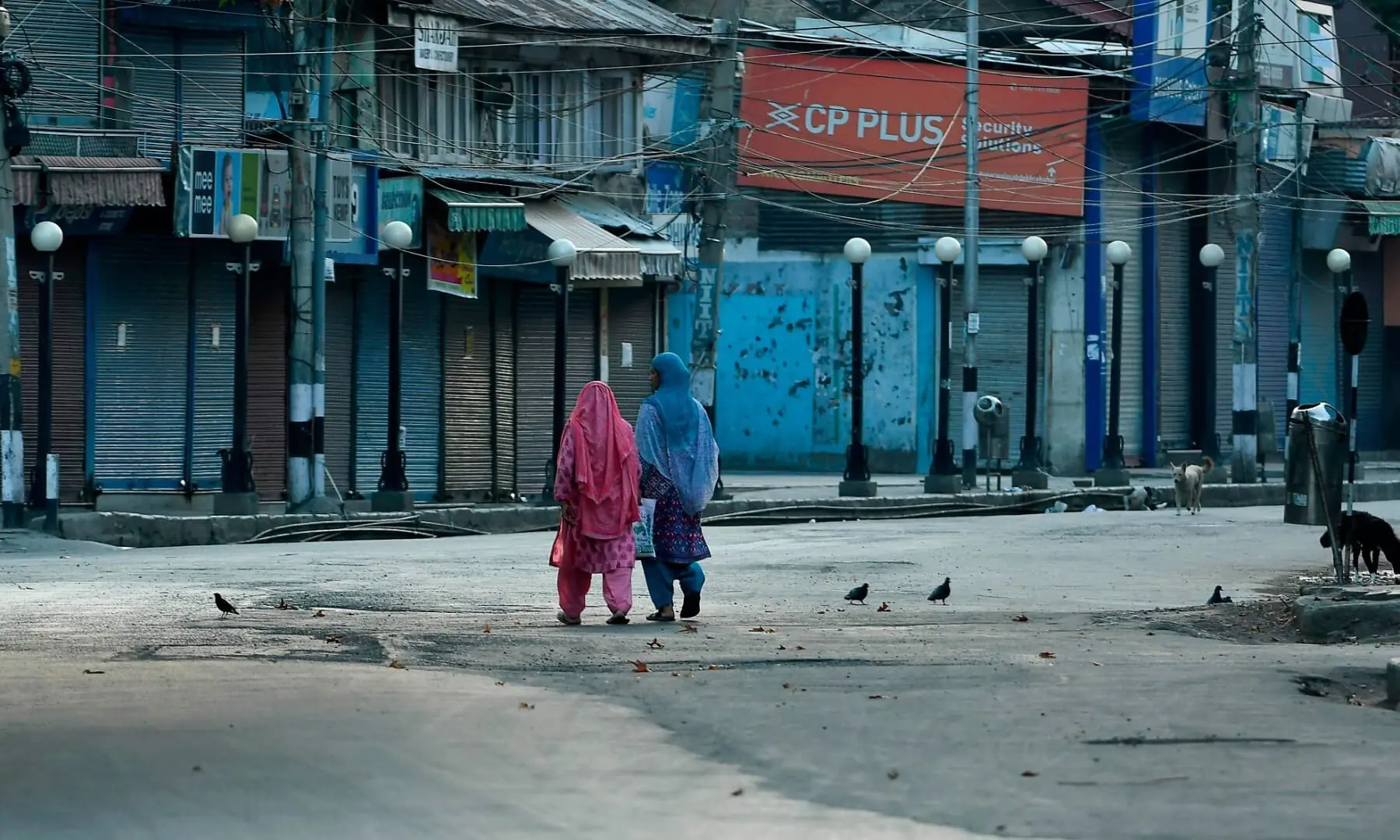 Women walk before a curfew in Srinagar on August 4, 2020. &mdash; AFP/File