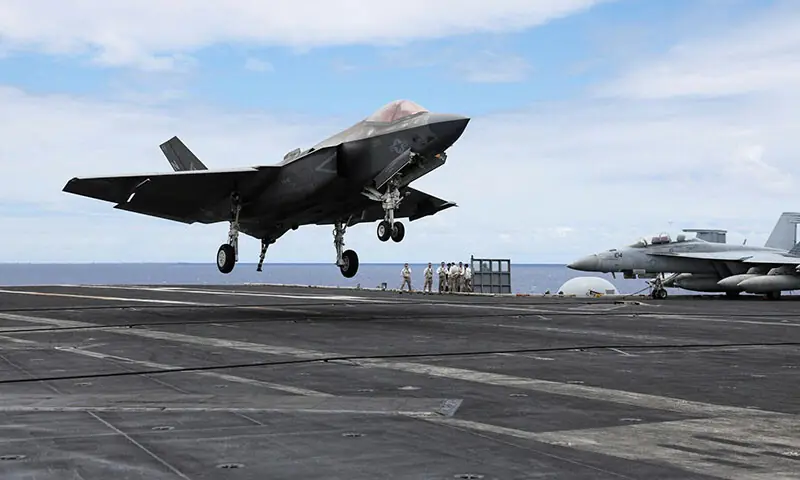 An F-35 jet lands on the flight deck of the USS Carl Vinson aircraft carrier south of Oahu, Hawaii in this file photo from July 2024. &mdash; Reuters/File