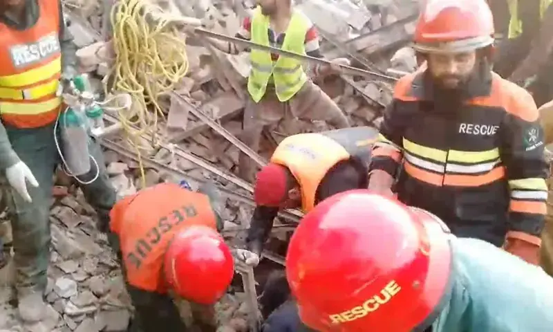 This image taken from a video provided by Rescue 1122 shows personnel trying to find people buried under the rubble. — Screenshot courtesy Rescue 1122 This image taken from a video provided by Rescue 1122 shows personnel trying to find people buried under the rubble. — Screenshot courtesy Rescue 1122