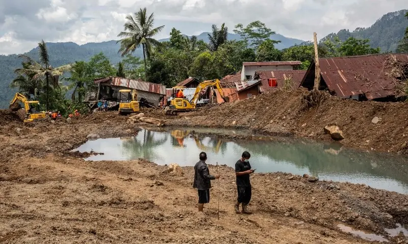 Residents walk at the site of a landslide in Situkung village, Banjarnegara, Central Java, on November 20, 2025. &mdash;AFP