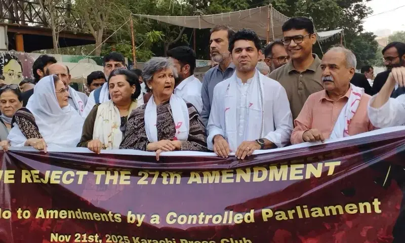 Civil society members stage a protest against the 27th Amendment outside Karachi Press Club on Nov 21. &mdash; Photo by Shifa