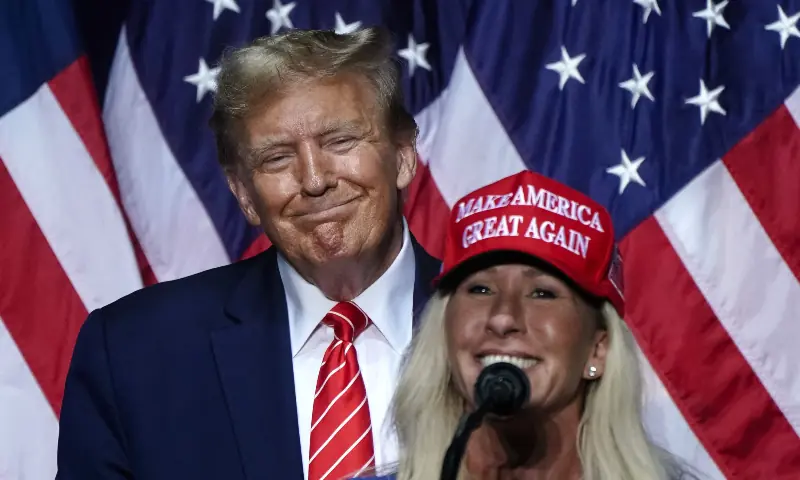 US Representative Marjorie Taylor Greene (R), Republican of Georgia, speaks alongside 2024 presidential hopeful Donald Trump at a campaign event in Rome, Georgia, on March 9, 2024. &mdash; AFP/File