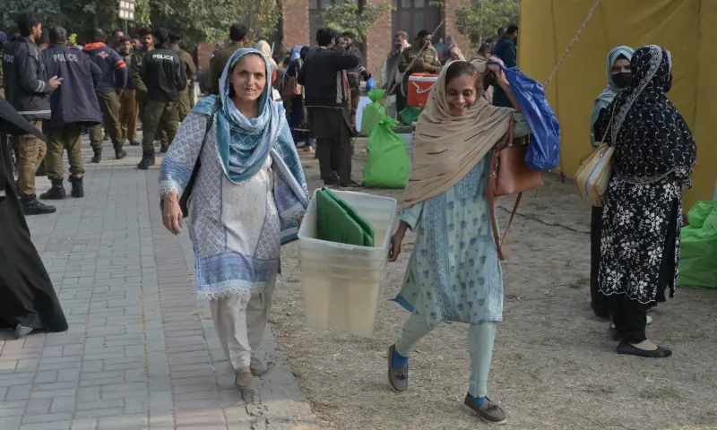 Teachers are carrying election materials for the by-elections at township in Lahore on Nov 22, 2025, a day before the polling. &mdash; White Star