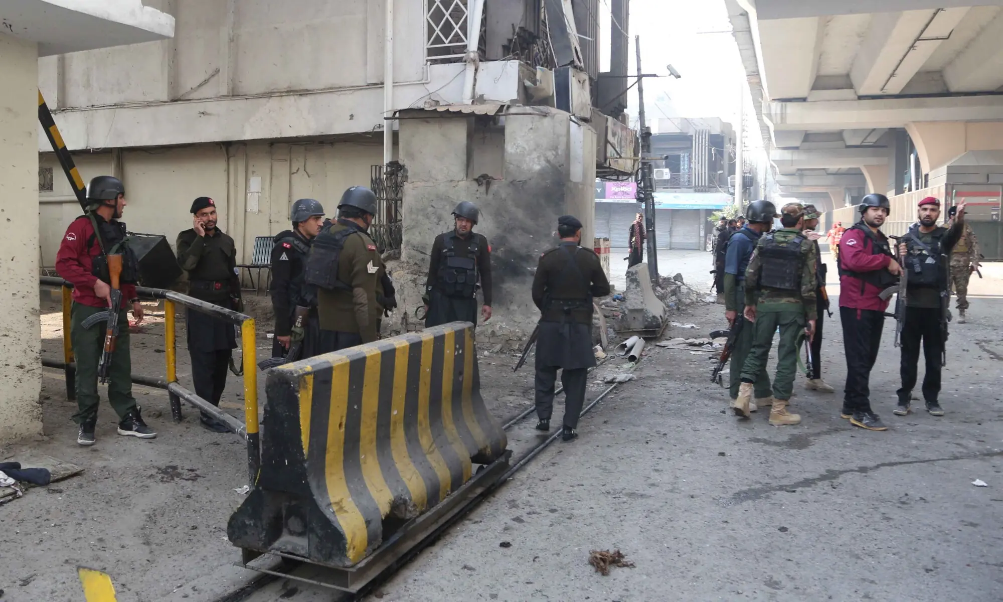 Army soldiers secure the entrance site after suicide bombers targeted the headquarters of a paramilitary force in Peshawar on November 24. — Reuters