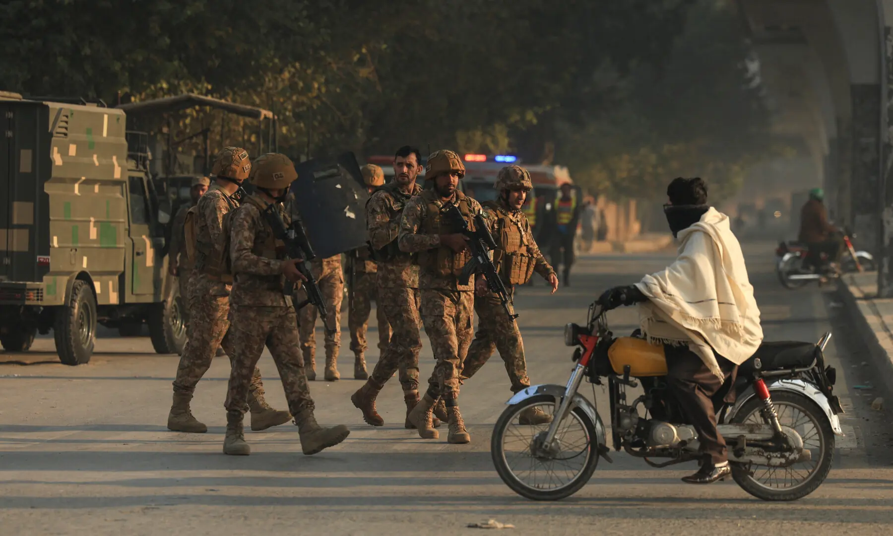 Army soldiers gather, after suicide bombers targeted the Federal Constabulary headquarters in Peshawar on November 24. — Reuters