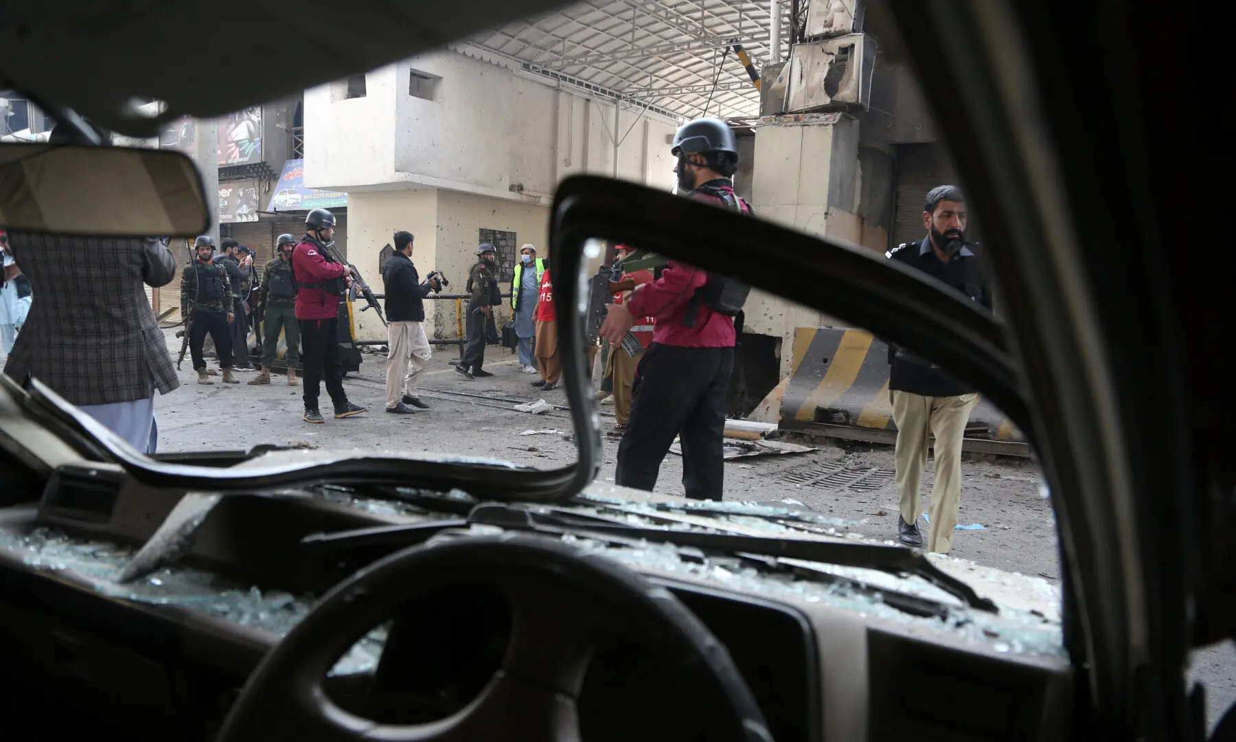 Paramilitary soldiers secure the entrance of the Federal Constabulary headquarters after suicide bombers targeted it in Peshawar on November 24. — Reuters
