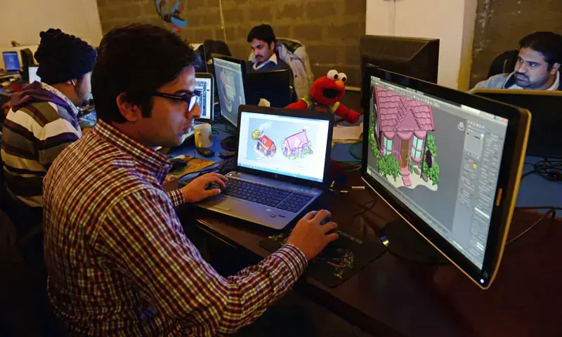 In this file photo, Pakistani game designers work at the game studio &ldquo;We R Play&rdquo; in Islamabad. &mdash; AFP/File