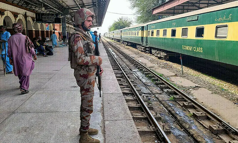 A paramilitary soldier stands guard at a railway station in the Sibi district of Balochistan on March 12. &mdash; AFP/File