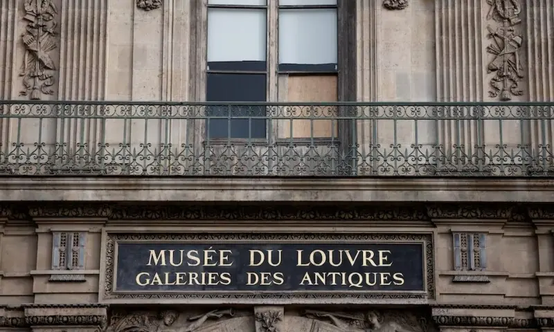 View of a broken window protected by a wooden panel at the Louvre Museum as the museum remains closed the day after a spectacular jewel heist by thieves who broke into the landmark by using a crane and smashing an upstairs window in Paris, France, on October 20. &mdash; Reuters/File