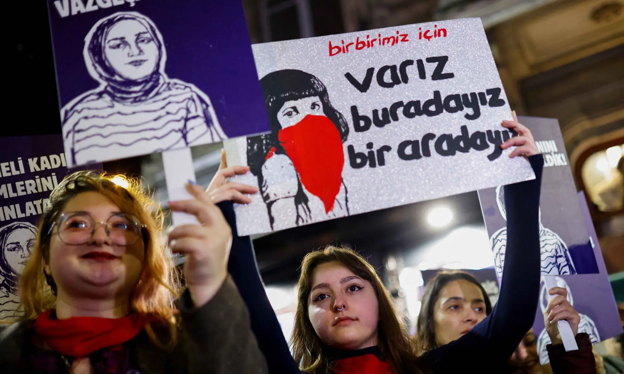 People hold placards as they attend a protest against femicide, sexual violence and all gender-based violence to mark the International Day for Elimination of Violence Against Women, in Istanbul on November 25. &mdash; Reuters