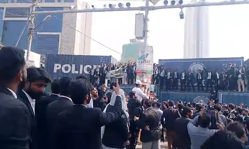 Containers placed on roads and police deployed as lawyers hold a protest march in Karachi on Nov 26. &mdash; Screengrab from video provided by author