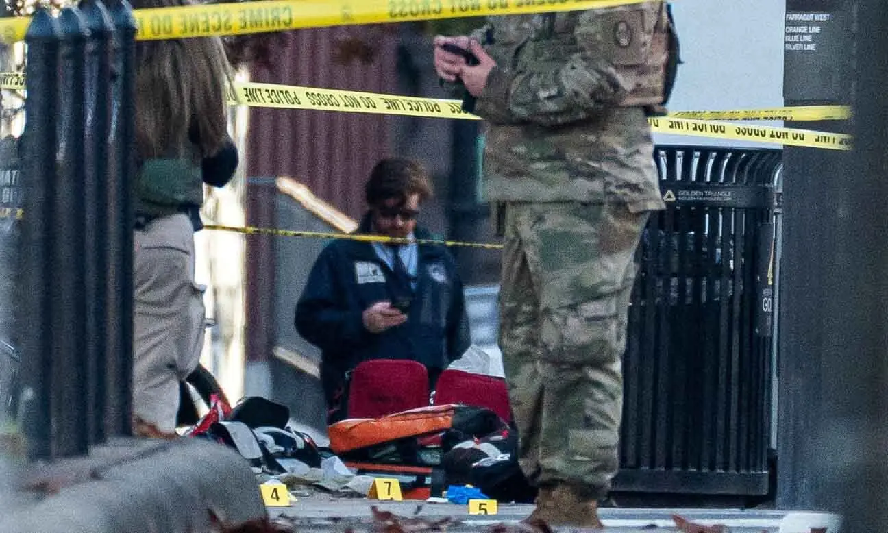 Evidence markers sit on the ground after two National Guard members were shot near the White House in Washington DC, US on November 26. &mdash; Reuters