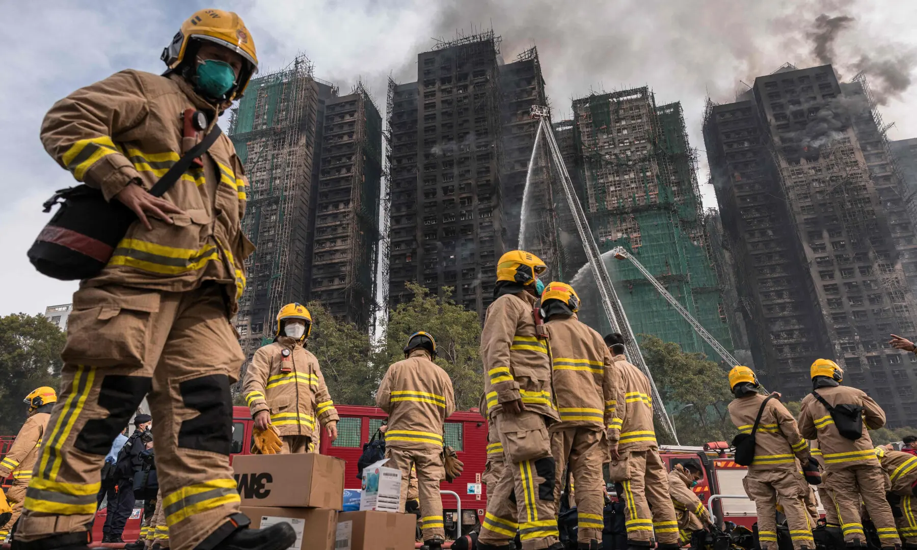 Firemen get ready after a major fire swept through several apartment blocks at the Wang Fuk Court residential estate in Hong Kong&rsquo;s Tai Po district on Nov 27, 2025. &mdash; AFP