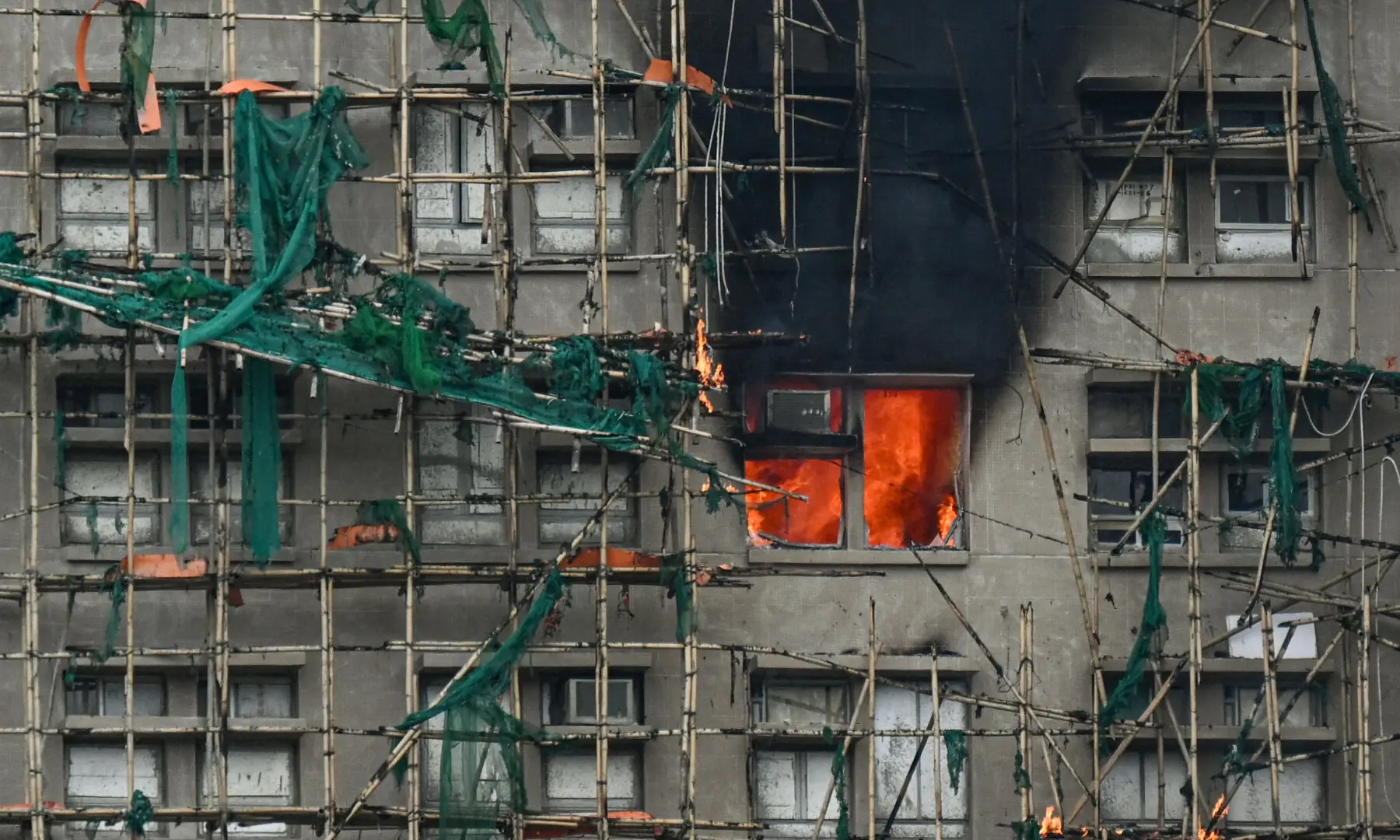 Apartments still burn as a major fire swept through several apartment blocks at the Wang Fuk Court residential estate in Hong Kong&rsquo;s Tai Po district on November 27, 2025. &mdash; AFP