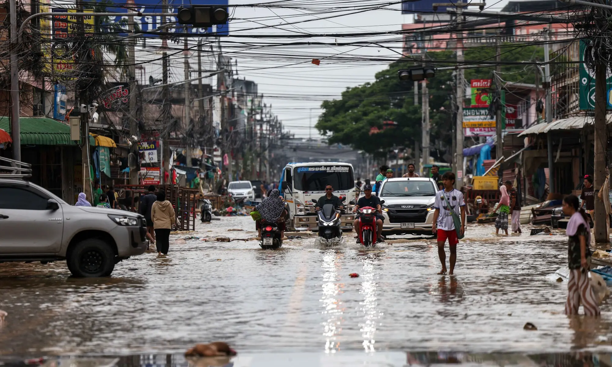 People commute through a flooded area in Hat Yai district, Songkhla province, Thailand, November 28, 2025. &mdash; Reuters