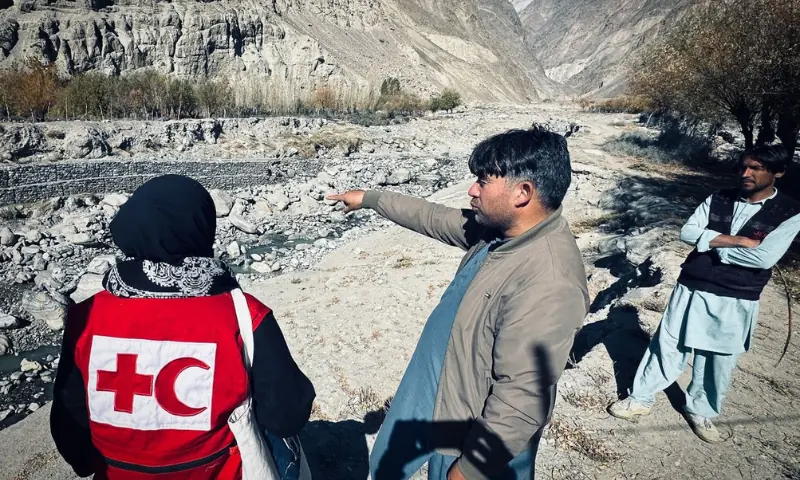 Community leader Mehdi Hassan with volunteer Aqueela Zehra showing the devasted stream that used to cross the village.
