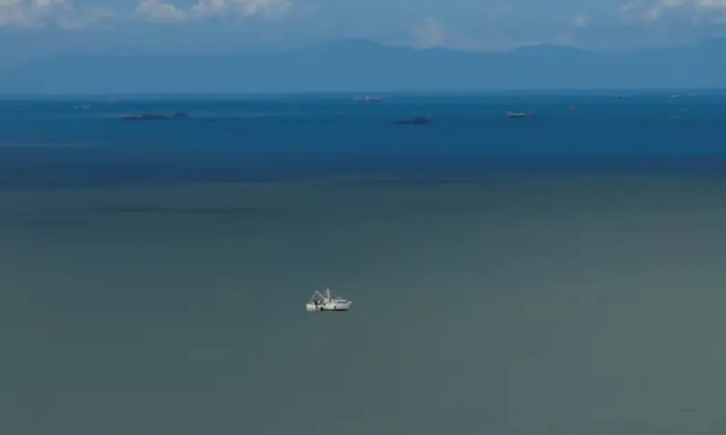 A drone view shows a fishing boat anchored in the Gulf of Paria, and the coast of Venezuela in the back, in Cedros, Trinidad and Tobago, November 17. &mdash; Reuters